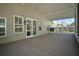 Screened in patio overlooking fenced backyard with beautiful landscaping at 1226 Baycrest Dr, Wesley Chapel, FL 33543