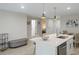 Open kitchen layout with a white countertop island, modern fixtures, and adjacent dining area at 12266 Edwards Rd, Port Charlotte, FL 33981