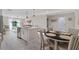 Open concept kitchen with stainless steel appliances, center island, and a dining area at 12266 Edwards Rd, Port Charlotte, FL 33981