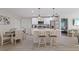Bright kitchen featuring white cabinets, stainless appliances, pendant lighting, and a center island at 12266 Edwards Rd, Port Charlotte, FL 33981