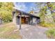 The home features a covered back patio area with access to the private backyard at 1249 Abbey Crescent Ln, Clearwater, FL 33759