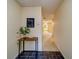 Inviting entryway featuring tile flooring, a charming welcome table, and a view of the home's layout at 1249 Abbey Crescent Ln, Clearwater, FL 33759