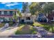 Charming townhome with mature trees, inviting landscaping and a private driveway at 1249 Abbey Crescent Ln, Clearwater, FL 33759