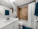 Bathroom featuring a modern vanity, toilet, and shower with tile surround at 12760 Indian Rocks Rd # 410, Largo, FL 33774