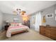 Cozy bedroom with a comfortable bed, ceiling fan, and natural light from the window at 12760 Indian Rocks Rd # 410, Largo, FL 33774