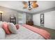 Comfortable bedroom with a bed and a large closet and a ceiling fan at 12760 Indian Rocks Rd # 410, Largo, FL 33774