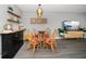 A dining area with a glass table, modern chairs, and stylish decor to showcase the condo's inviting atmosphere at 12760 Indian Rocks Rd # 410, Largo, FL 33774