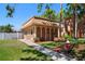 Exterior of a building with unique architectural details, landscaping, and a welcoming pathway at 12760 Indian Rocks Rd # 410, Largo, FL 33774