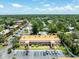 A condo exterior featuring a second-story balcony, landscaping, and plenty of parking, making it a desirable residence at 12760 Indian Rocks Rd # 410, Largo, FL 33774