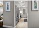 Hallway view of kitchen with stainless steel refrigerator, cabinets, and appliances at 12760 Indian Rocks Rd # 410, Largo, FL 33774