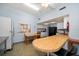 Kitchen area featuring essential appliances, a dining table, and a breakfast bar at 12760 Indian Rocks Rd # 410, Largo, FL 33774