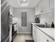 Efficient kitchen featuring white cabinets, sleek countertops, and stainless steel appliances at 12760 Indian Rocks Rd # 410, Largo, FL 33774