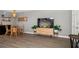 An open-concept living and dining space with contemporary flooring, a television, and stylish furnishings for comfortable living at 12760 Indian Rocks Rd # 410, Largo, FL 33774