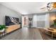 A bright living room featuring modern flooring, a ceiling fan, and natural light to show the condo's style and comfort at 12760 Indian Rocks Rd # 410, Largo, FL 33774