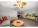 Open-concept living room featuring stylish furniture and adjacent dining area at 12760 Indian Rocks Rd # 410, Largo, FL 33774