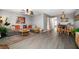 A stylish living room with wood-look floors, a comfortable sofa, and unique decor to showcase the condo's charm at 12760 Indian Rocks Rd # 410, Largo, FL 33774