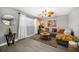 A cozy living room with modern flooring, a comfortable sofa, and natural light, enhancing the condo's appeal at 12760 Indian Rocks Rd # 410, Largo, FL 33774