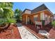 Exterior view of the office with well manicured landscape and a brick-paved walkway leading to an arched entrance at 12760 Indian Rocks Rd # 410, Largo, FL 33774