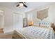 The bedroom features carpet, ceiling fan and dual shuttered windows for ample light at 1408 Michigan Ave, Palm Harbor, FL 34683