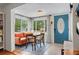 Cozy dining space filled with natural light and views of a lush outdoors at 1408 Michigan Ave, Palm Harbor, FL 34683