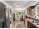 Functional kitchen with stainless steel appliances, and dark wood cabinetry at 1408 Michigan Ave, Palm Harbor, FL 34683