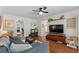Comfortable living space featuring wood floors and access to multiple rooms at 1408 Michigan Ave, Palm Harbor, FL 34683