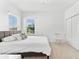Bedroom with plush carpeting, and natural light highlighting a comfortable and serene space for relaxation and rest at 1416 Via Verdi Dr, Palm Harbor, FL 34683