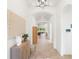 Bright hallway with arched doorways and modern decor, leading to an open living space with plenty of light at 1416 Via Verdi Dr, Palm Harbor, FL 34683
