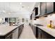 Gourmet kitchen showcasing a spacious layout, modern appliances, and an expansive island with bar seating at 1416 Via Verdi Dr, Palm Harbor, FL 34683