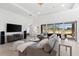 Relaxing living room with a neutral color palette, comfortable seating, and a view of the outdoor landscape at 1416 Via Verdi Dr, Palm Harbor, FL 34683