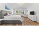 Spacious main bedroom boasts wood floors, tray ceilings, lots of natural light, and a sitting area at 1416 Via Verdi Dr, Palm Harbor, FL 34683