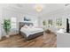 Spacious main bedroom boasts wood floors, tray ceilings, lots of natural light, and a sitting area at 1416 Via Verdi Dr, Palm Harbor, FL 34683