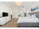 Spacious main bedroom boasts wood floors, tray ceilings, lots of natural light, and a sitting area at 1416 Via Verdi Dr, Palm Harbor, FL 34683