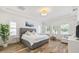 Spacious main bedroom boasts wood floors, tray ceilings, lots of natural light, and a sitting area at 1416 Via Verdi Dr, Palm Harbor, FL 34683