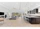 Inviting open-concept living space seamlessly connecting the living room and kitchen with modern finishes at 1416 Via Verdi Dr, Palm Harbor, FL 34683