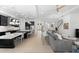 Spacious open-concept layout featuring a modern kitchen, dining area, and inviting living room with stylish decor at 1416 Via Verdi Dr, Palm Harbor, FL 34683