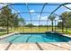 The pool features a relaxing spa and screened enclosure with a gorgeous golf course view at 1416 Via Verdi Dr, Palm Harbor, FL 34683
