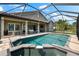 Relaxing screened pool and patio area includes a spa and an outdoor seating area at 1416 Via Verdi Dr, Palm Harbor, FL 34683