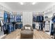 Spacious walk-in closet features custom shelving, ample storage, and natural light, creating an organized and elegant space at 1416 Via Verdi Dr, Palm Harbor, FL 34683