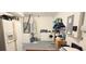 Unfinished basement with laundry area, shelving, and a refrigerator, offering potential for customization at 15124 Deer Meadow Dr, Lutz, FL 33559
