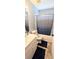 Well-lit bathroom with a single sink vanity, toilet, and a shower-tub combo with modern fixtures at 15124 Deer Meadow Dr, Lutz, FL 33559