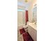 Functional bathroom featuring a single sink vanity, toilet, and a shower-tub combination, with a window for natural light at 15124 Deer Meadow Dr, Lutz, FL 33559