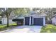 Charming single-Gathering home with a two-car garage and well-maintained landscaping, offers curb appeal and convenience at 15124 Deer Meadow Dr, Lutz, FL 33559