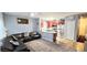Inviting living room with a cozy leather sectional, adjacent to the kitchen with stainless steel appliances at 15124 Deer Meadow Dr, Lutz, FL 33559