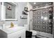 Stylish bathroom features modern fixtures, patterned tile in the shower, and sleek vanity at 1603 Fluorshire Dr, Brandon, FL 33511