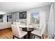 Cozy dining area featuring a glass table, seating for four, and natural light from the window at 1603 Fluorshire Dr, Brandon, FL 33511