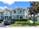 Charming two-story townhouse with manicured landscaping and a designated parking space visible at 1603 Fluorshire Dr, Brandon, FL 33511