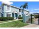Inviting two-story townhouse featuring a private entrance, manicured lawn, and secure gated entry at 1603 Fluorshire Dr, Brandon, FL 33511