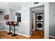 Convenient laundry area adjacent to kitchen with stacked washer and dryer and easy access at 1603 Fluorshire Dr, Brandon, FL 33511