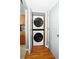 Efficient laundry area features a stacked washer and dryer, maximizing space and convenience for residents at 1603 Fluorshire Dr, Brandon, FL 33511